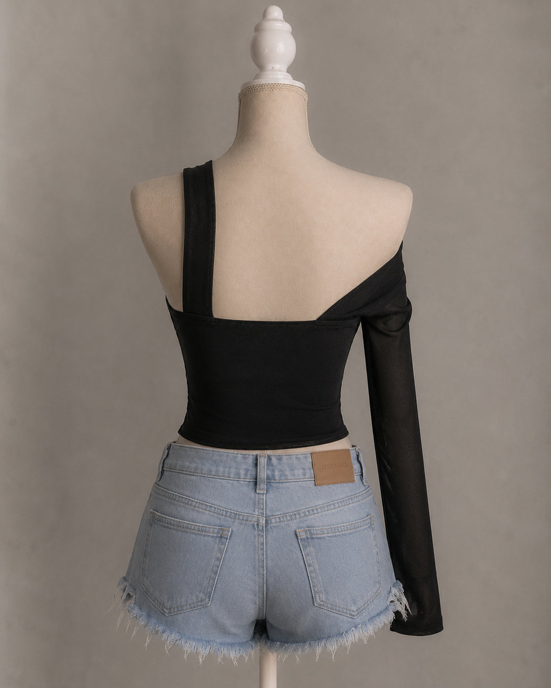 STAY SINGLE ASYMMETRICAL CORSETED BLACK TOP