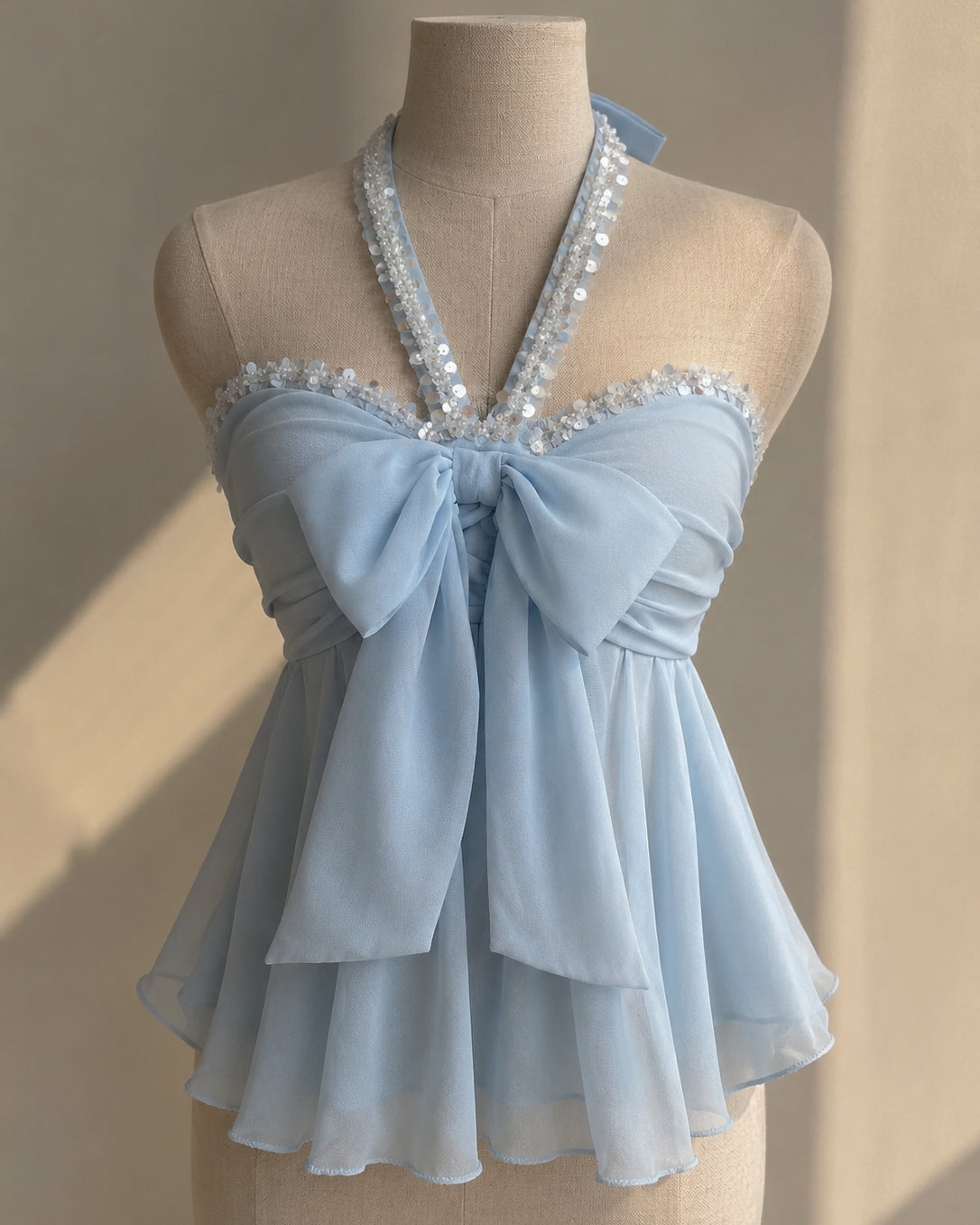 PRETTY TWICE PADDED SHIMMER DETAIL BOW BLUE HALTERNECK TOP