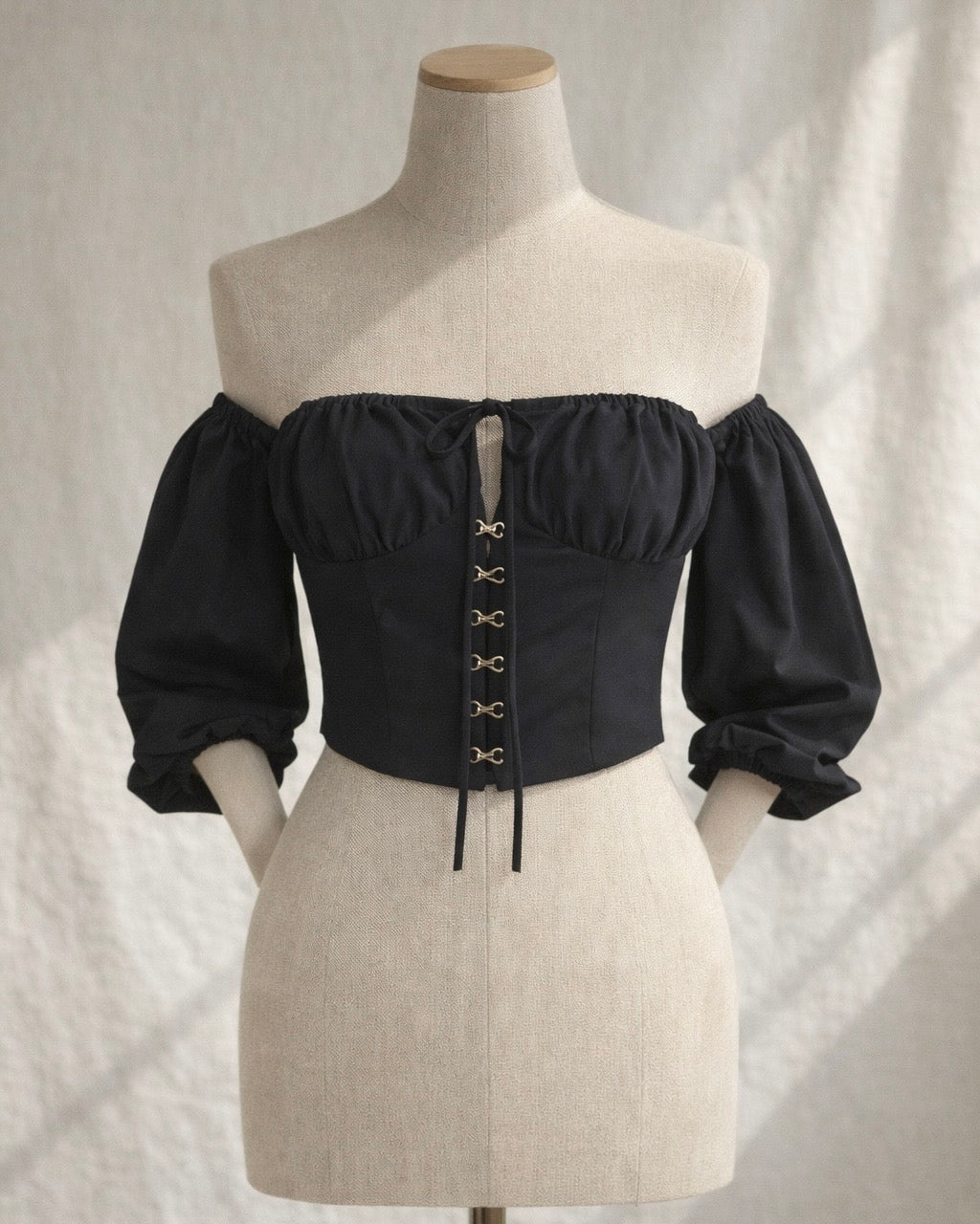 TOTAL KNOCKOUT OFF-SHOULDER HOOK-EYE BLACK TOP