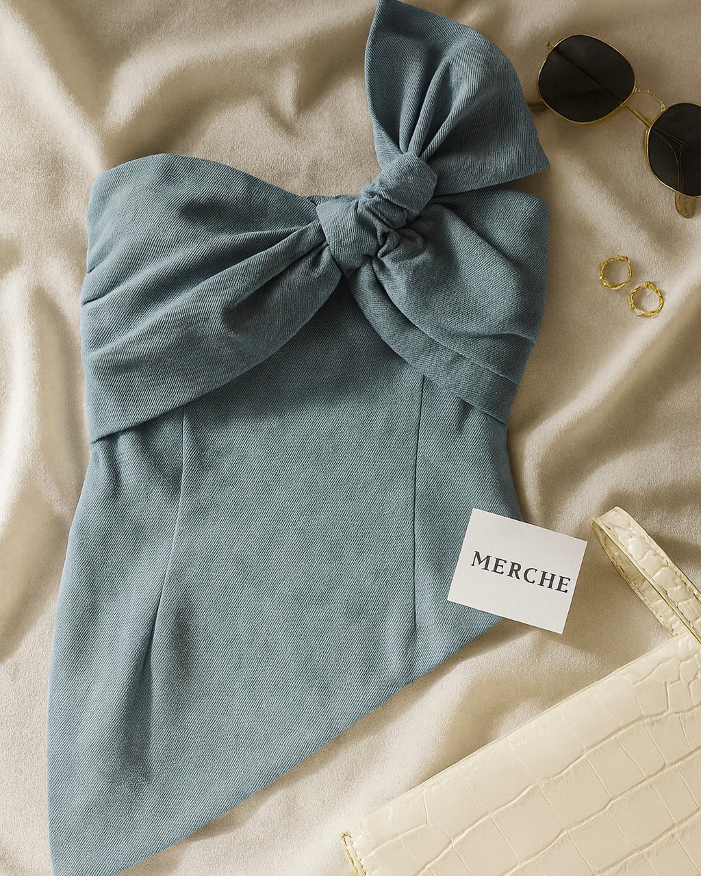 STALKER ALERT DENIM ASYMMETRICAL STRAPLESS TOP