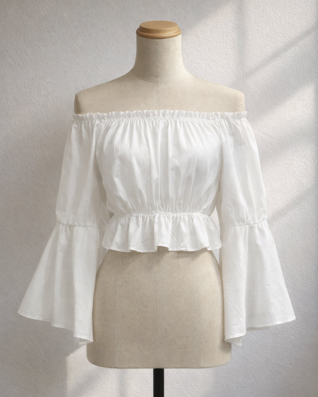 PLANETS GOT ME WHITE OFF-SHOULDER TOP